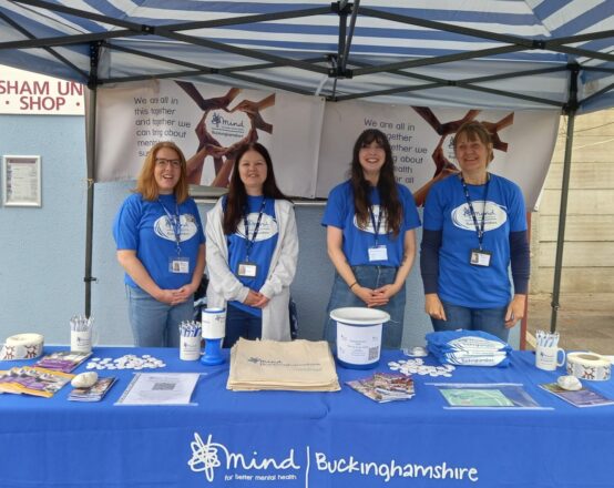 Bucks Mind stall with smiling volunteers