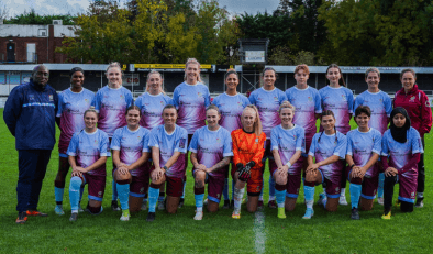Women's football team smiling